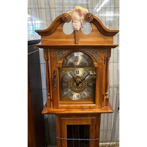 429 - Modern pine three train long case clock with broken arch pediment above arched brass Roman face, gla... 