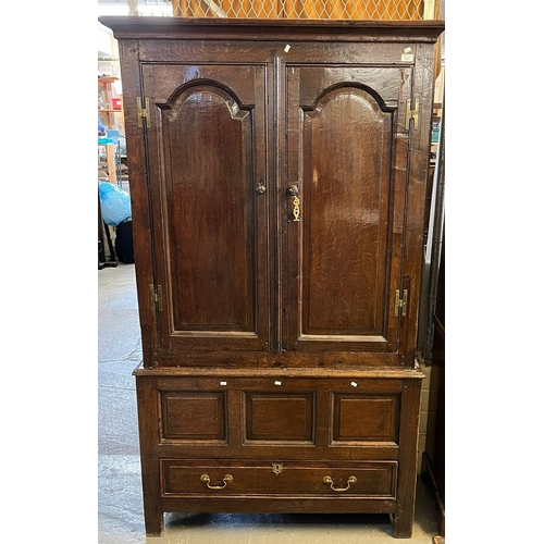 431 - 18th century oak vestment cupboard, having moulded cornice over two arch moulded fielded panel doors... 