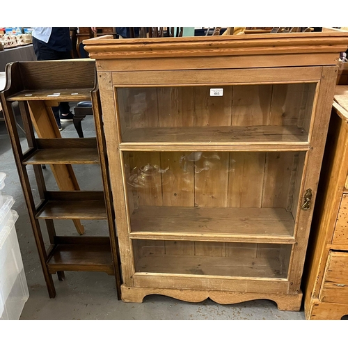 445 - Stripped pine glazed cabinet with single door, two fitted shelves, on bracket feet.  76cm wide appro... 