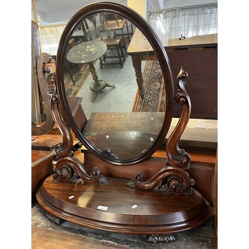 455 - Victorian mahogany dressing table mirror having oval plate supported on scrolled foliate arms on an ... 