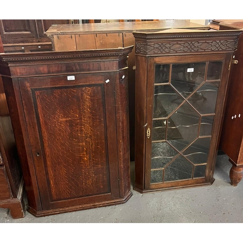 458 - 19th century oak blind panelled single door corner cupboard, the dental cornice above an interior of... 