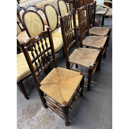 465 - Four similar Lancashire style spindle back chairs with rush seats.  (4)   (B.P. 21% + VAT)