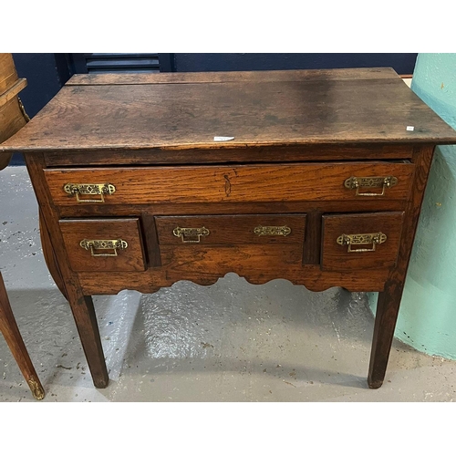 473 - 18th century Welsh oak lowboy with single frieze drawer over three short drawers and a shaped apron ... 