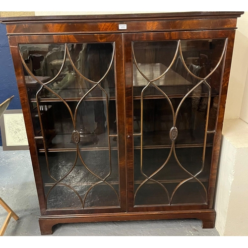 475 - Georgian Adam style mahogany two door glazed bookcase with adjustable shelves on bracket feet.  124c... 