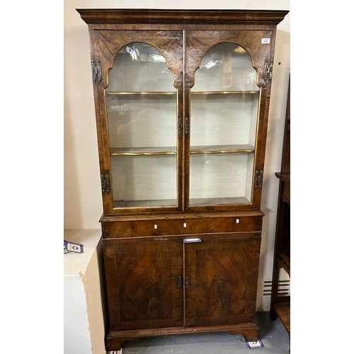 476 - 18th century style walnut and simulated walnut two door glazed bookcase of narrow proportions.  92x2... 