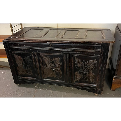 493 - 18th century stained oak coffer, the hinged moulded top above three foliate panels on associate cast... 