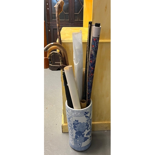 512 - Modern Chinese design blue and white stick stand containing assorted walking sticks, architectural p... 