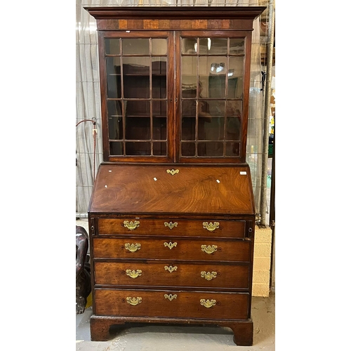 543 - George III mahogany bureau bookcase with fitted interior and three graduated drawers on bracket feet... 