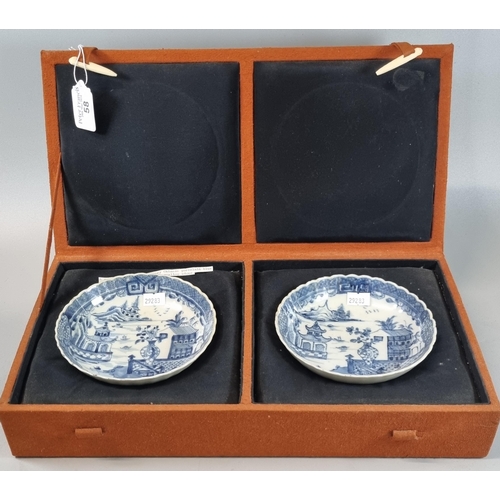 58 - Matched pair of 18th century Chinese export blue and white foliate rim saucer dishes with scalloped ... 