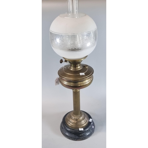 87 - Early 20th century double oil burner, having frosted and etched globular shade above a brass reservo... 