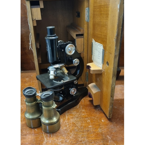 91 - Pair of Kelvin Hughes No. 1370 brass binoculars together with a cased E. Leitz Wetzlar microscope.  ... 