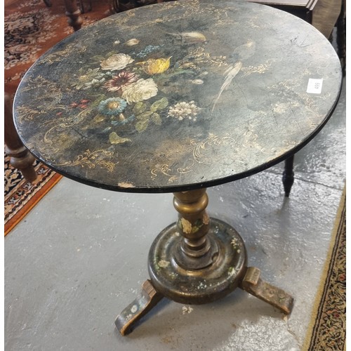 499 - 19th century painted papier mache pedestal wine table with bird and floral decoration.  56cm diamete... 