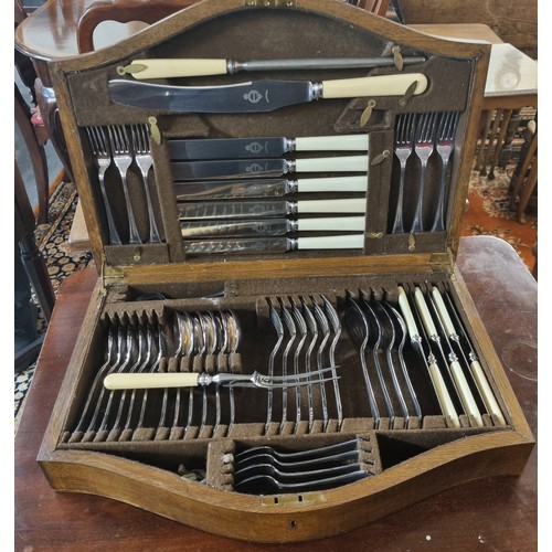 501 - Oak cased canteen of stainless cutlery, appearing complete.  (B.P. 21% + VAT)