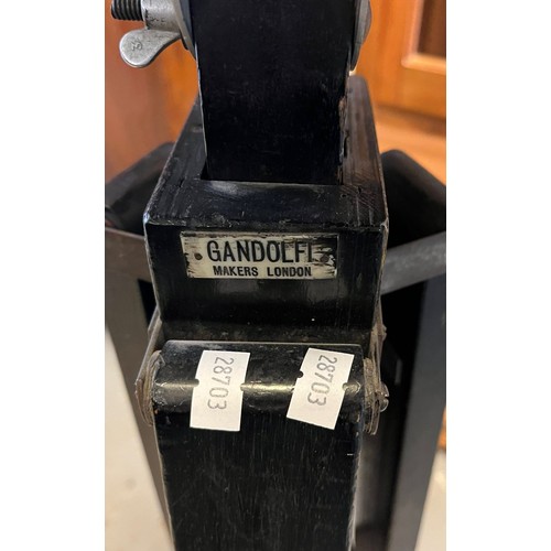 428 - Vintage photographer's wooden extendable tripod with associated leather covered case. Labelled Gando... 