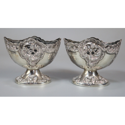 178 - Pair of silver repoussé boat shaped salts.  Birmingham hallmarks.  2.4 troy oz approx.   (B.P. 21% +... 