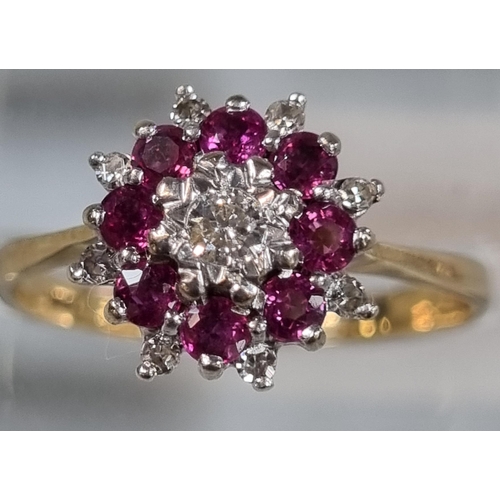 196 - 9ct gold diamond and rubies flowerhead ring.  2.6g approx.  Size P1/2.  (B.P. 21% + VAT)