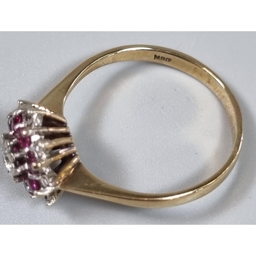 196 - 9ct gold diamond and rubies flowerhead ring.  2.6g approx.  Size P1/2.  (B.P. 21% + VAT)