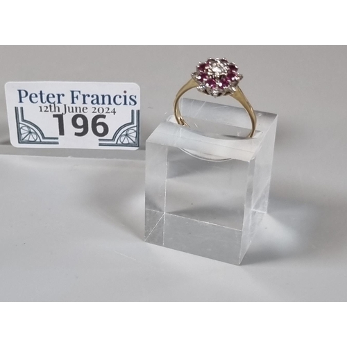 196 - 9ct gold diamond and rubies flowerhead ring.  2.6g approx.  Size P1/2.  (B.P. 21% + VAT)