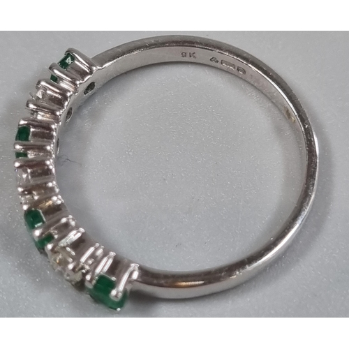 198 - 9ct white gold diamond and emerald seven stone ring.  2.1g approx.  Size K.  (B.P. 21% + VAT)