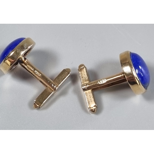 215 - Pair of 9ct gold cufflinks inset with lapis lazuli cabochon stones.  10g approx.  (B.P. 21% + VAT)