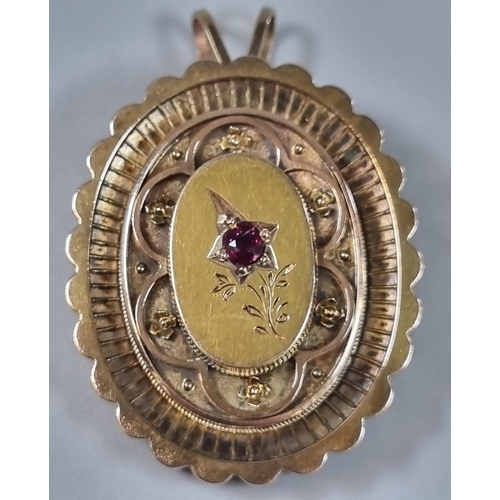 225 - Victorian yellow metal mourning locket inset with small ruby stone.  11.4g approx.  (B.P. 21% + VAT)