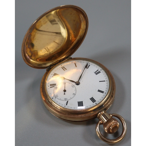 228 - Yellow metal full hunter top wind pocket watch with white enamel Roman face having seconds dial.  En... 