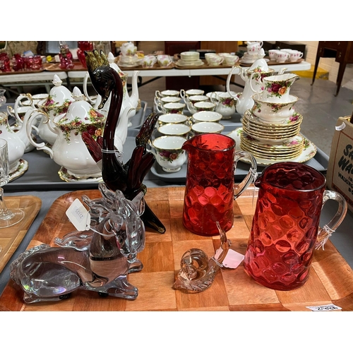 288A - Tray of glassware to include: pair of Victorian Cranberry glass jugs, and three Art Glass animals/cr... 