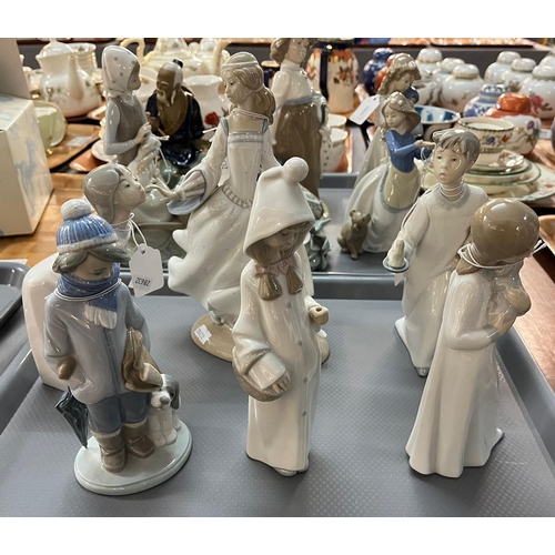 297 - Two trays of mainly Lladro and Nao Spanish porcelain figurines of young children with animals: girl ... 