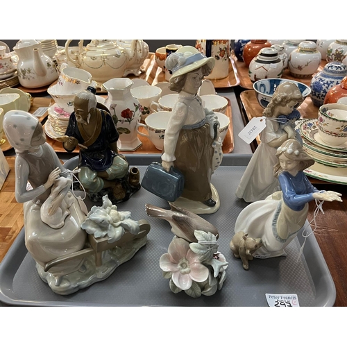 297 - Two trays of mainly Lladro and Nao Spanish porcelain figurines of young children with animals: girl ... 