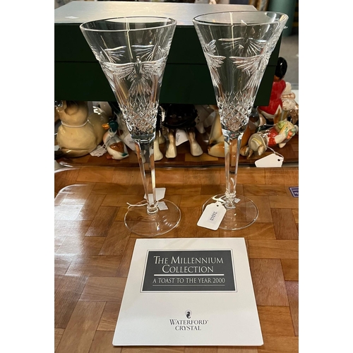 306 - Pair of Waterford Crystal Millennium glass flutes.    (B.P. 21% + VAT)