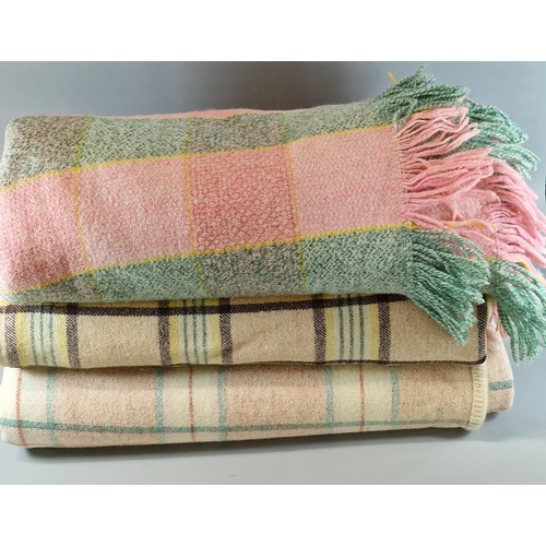 106 - Yellow, beige and brown checked blanket together with a pink and green checked blanket and another c... 