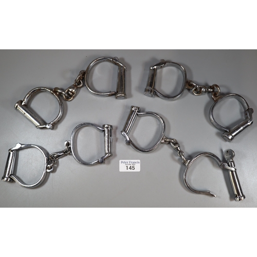 145 - Four pairs of chromed Hiatt type barrel handcuffs issued 1950's (no keys) (B.P. 21% + VAT)