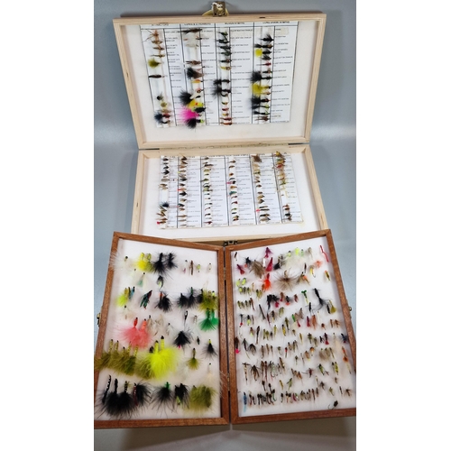 153 - Two wooden cases of various fly fishing flies, some named. (2) (B.P. 21% + VAT)