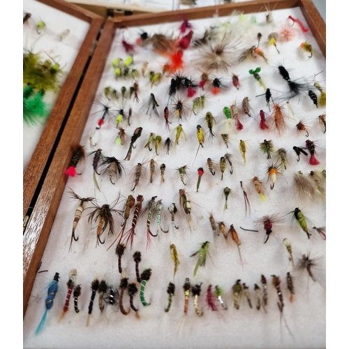 153 - Two wooden cases of various fly fishing flies, some named. (2) (B.P. 21% + VAT)