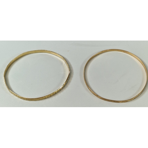 193 - Two 9ct gold engraved bangles. 10g approx. (B.P. 21% + VAT)