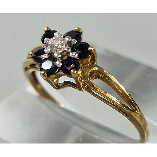 195 - 9ct gold diamond and sapphire flowerhead cluster ring. 1.3g approx. size M1/2 (B.P. 21% + VAT)