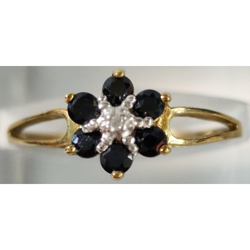 195 - 9ct gold diamond and sapphire flowerhead cluster ring. 1.3g approx. size M1/2 (B.P. 21% + VAT)