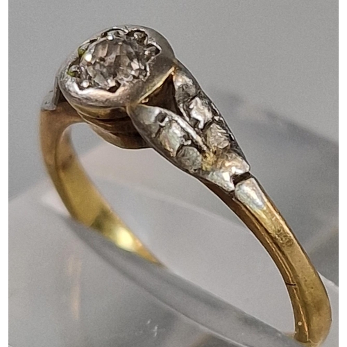 196 - Gold diamond solitaire ring with white metal mounts and shoulders. 2.4g approx. Size K.  (B.P. 21% +... 