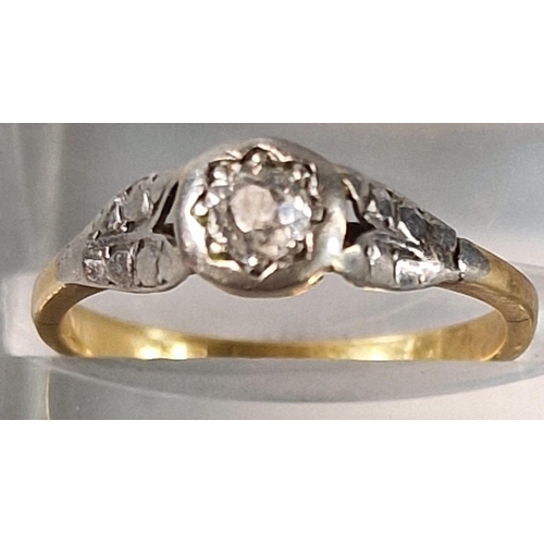 196 - Gold diamond solitaire ring with white metal mounts and shoulders. 2.4g approx. Size K.  (B.P. 21% +... 