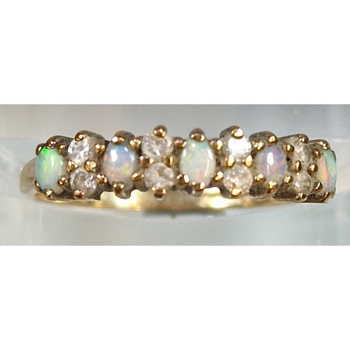 204 - 9ct gold thirteen stone opal and clear stone ring. 1.4g approx. Size M.  (B.P. 21% + VAT)