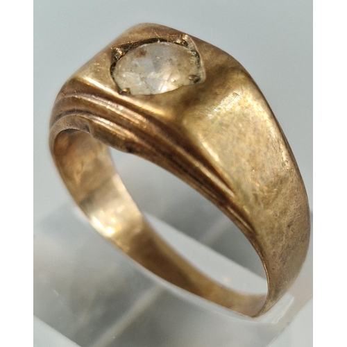 208 - 9ct gold signet type ring inset with a clear paste stone. 9.3g approx. Size V.  (B.P. 21% + VAT)