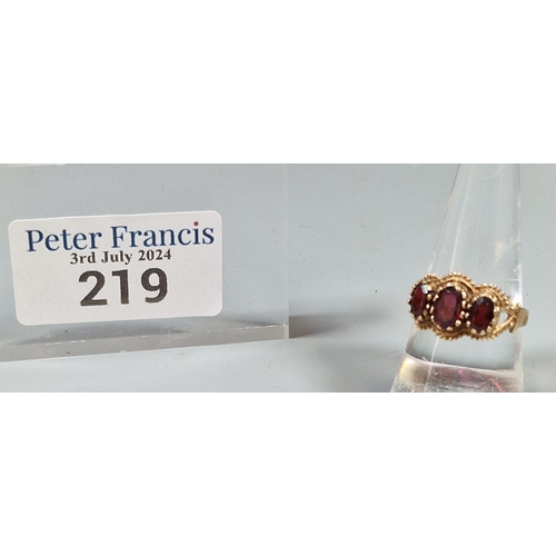 219 - 9ct gold three stone garnet ring, 2.9g approx. Ring size Q (B.P. 21% + VAT)