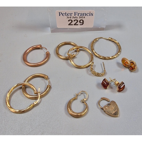 229 - 9ct gold heart shaped padlock together with a collection of 9ct gold hoop and other earrings, some s... 