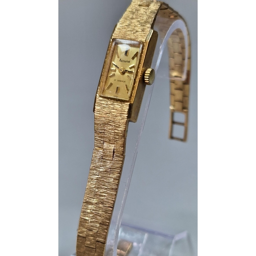 241 - Accurist 9 carat gold wristwatch having small rectangular head with baton numerals and integral bark... 