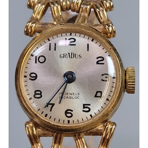 242 - Gradus 9ct gold ladies' bracelet wristwatch with satin face having Arabic numerals and pierced gate ... 