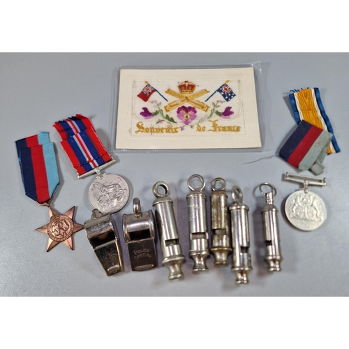 250 - Collection of whistles to include: Police military, WW2 medals and WWI silk postcard (B.P. 21% + VAT... 