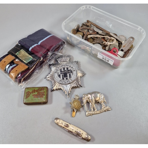 254 - Northumbria Police helmut badge, together with other oddments: penknife, whistle, coins, hussars cap... 