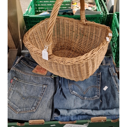 300 - Box of Levi denim jeans together with a wicker basket. (B.P. 21% + VAT)