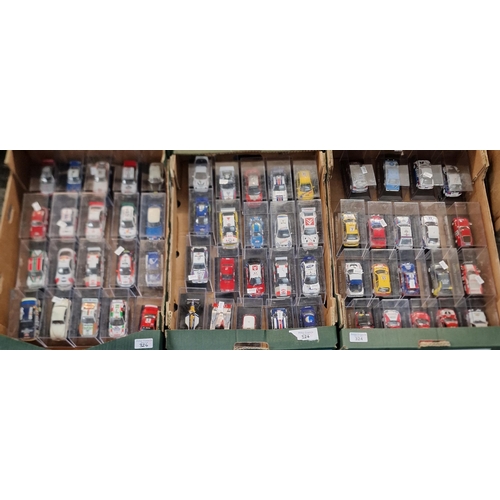 324 - Three trays of diecast model vehicles of Rally or Touring cars in perspex cases. Approximately 55.  ... 