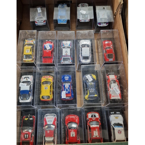 324 - Three trays of diecast model vehicles of Rally or Touring cars in perspex cases. Approximately 55.  ... 